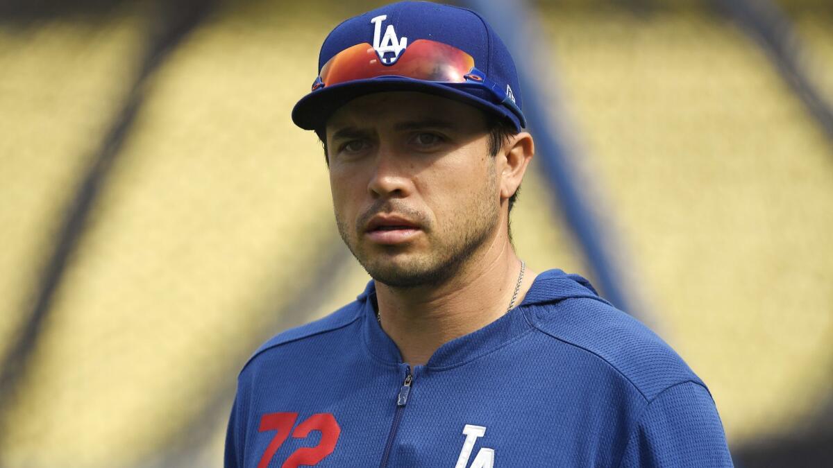 Dodgers catcher Travis d'Arnaud looks on during batting practice before the start of a game against the Atlanta Braves at Dodger Stadium on Monday.