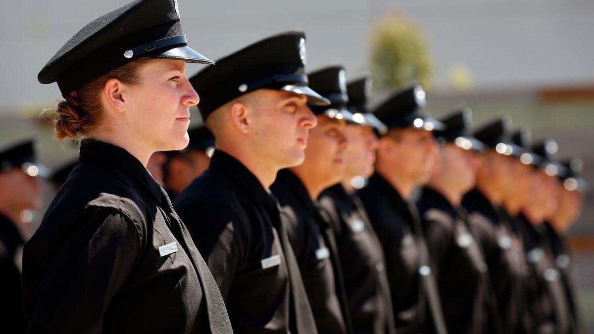 Five women graduated from a Los Angeles Fire Department training academy class in April 2016. The department is struggling to reach Mayor Eric Garcetti's goal of having women make up 5% of the city's firefighters by 2020.
