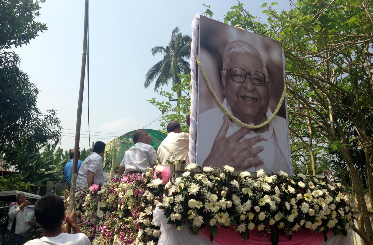 The funeral procession for S.N. Goenka, a guru who started meditation centers around the world, travels through the streets of Yangon, Myanmar.