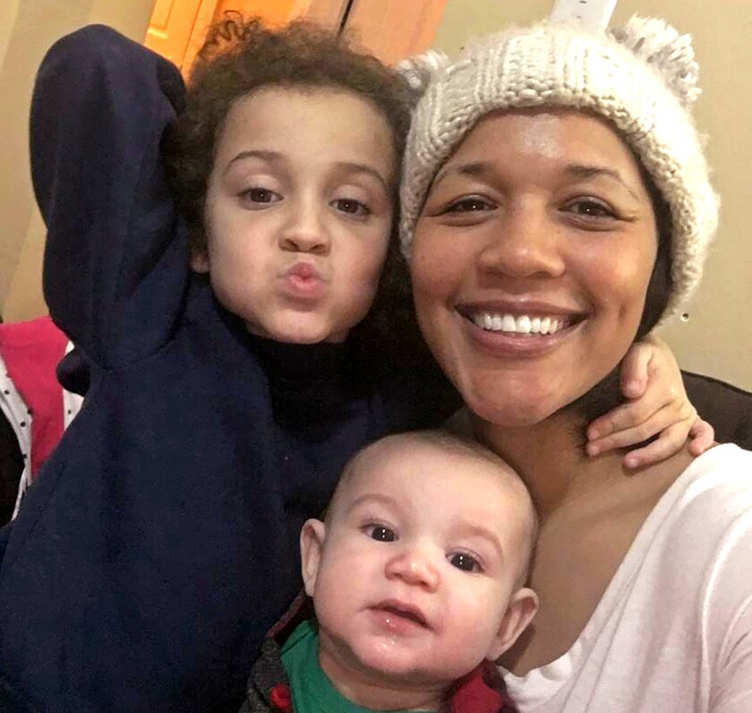 Cydnee Rafferty of New York with her two children, Devin, 5, and Leo, 5 months. Rafferty is African American and her husband is white and they often have to assure strangers that they are the children's parents.