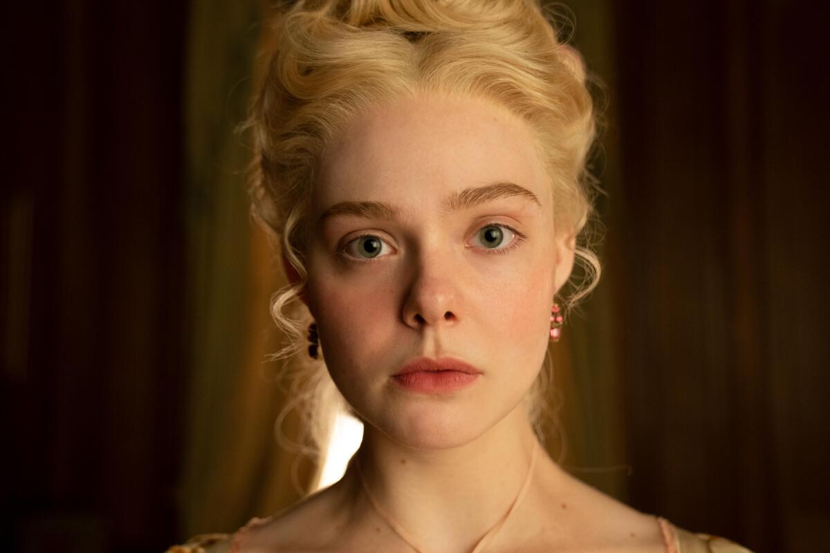 Elle Fanning as Catherine the Great, looking directly into the camera