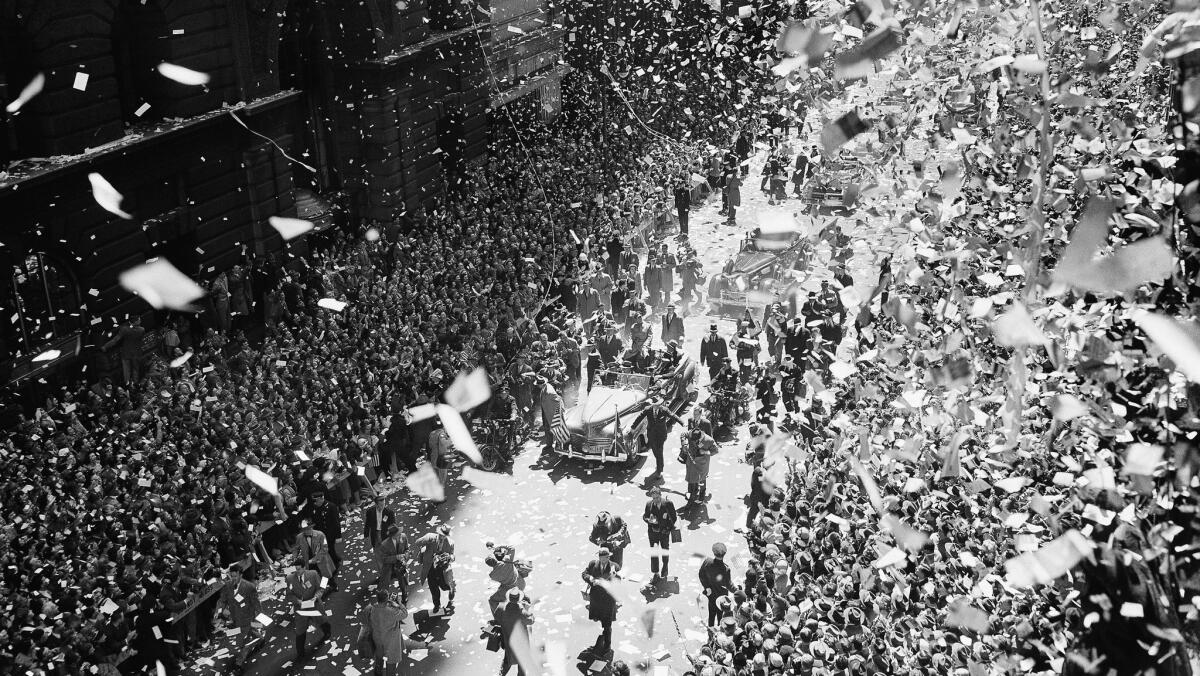 A blizzard of ticker tape and confetti virtually blots out the scene on lower Broadway as New Yorkers welcome Gen. Douglas MacArthur on April 20, 1951.