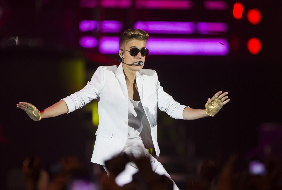 Legislation approved by a California Assembly committee would bar the use of robotic software to buy tickets to concerts and sporting events in the state. Above, Justin Bieber performing in Berlin last month.