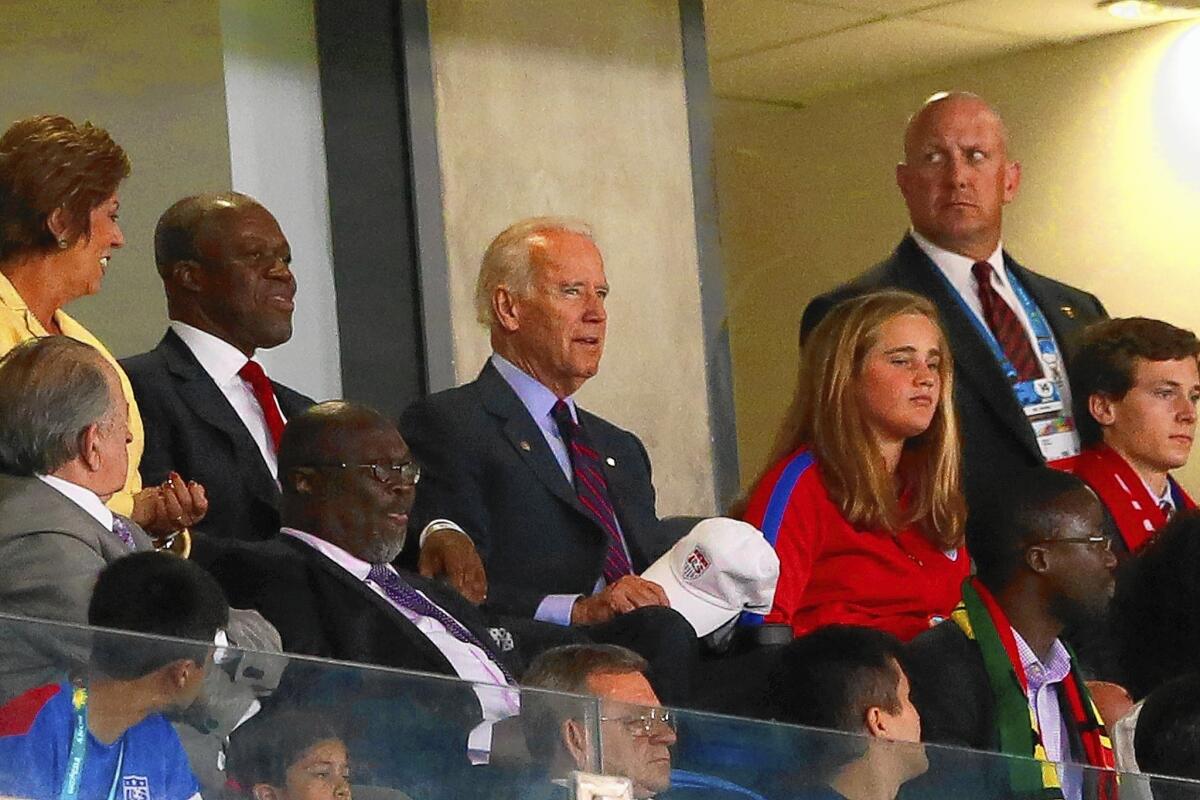 Vice President Joe Biden watches the World Cup match between the U.S. and Ghana in Natal, Brazil. He will head later to Central America to meet with leaders over the wave of child immigrants coming into the United States.