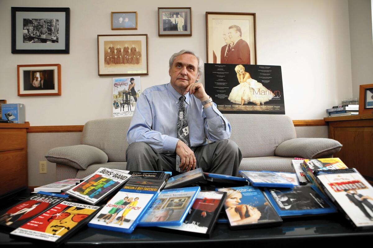 Judge Alex Kozinski in his chambers with a collection of movies. He started hosting movie nights years ago after learning that many of the law clerks in Pasadena had never seen “12 Angry Men,” the Henry Fonda classic about a holdout juror.