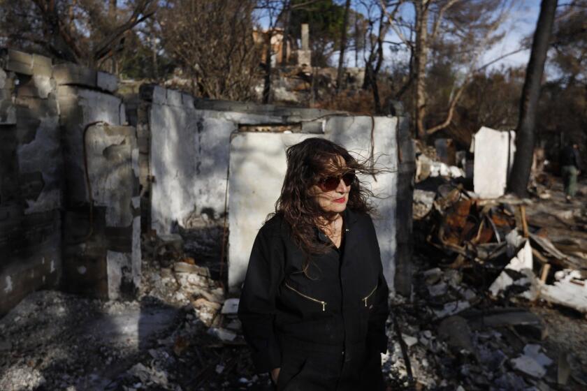 MALIBU, CA - JANUARY 22, 2019 - - ?For three weeks, I woke up every single morning and cried for hours. Even now, I still do," said artist Lita Albuquerque, 73, while visiting her home and property that was destroyed in the Woolsey fire in Malibu on January 22, 2019. Lost were paintings, drawings, five decades of diaries, her pigment collection and her expansive library. Albuquerque, who has called Malibu home for almost 30 years, was away on November 9 when the fire raced up the canyon, giving her pregnant daughter only enough time to grab the family dog before fleeing the flames. By the time she was allowed to return, Albuquerque found only rubble and dust where nine buildings had once stood. (Genaro Molina/Los Angeles Times) ATTENTION PRE-PRESS: PLEASE DO NOT LIGHTEN. HOPING TO KEEP THE DRAMA OF THE ORIGINAL EXPOSURE. THANKS.