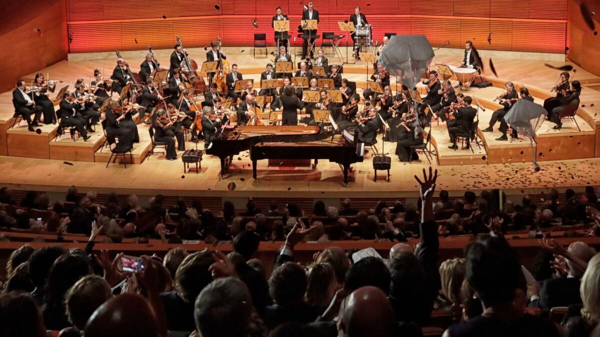 Confetti and the chocolate-and-marzipan Mozartkugeln rain onto the Walt Disney Concert Hall audience as the L.A. Phil plays an encore at its season-opening gala.