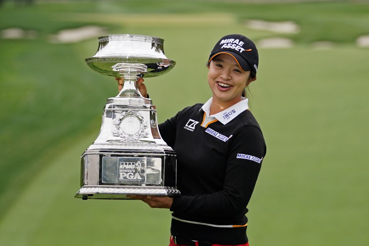 Sei Young Kim, of South Korea, holds the trophy after winning the KPMG Women's PGA Championship golf tournament at the Aronimink Golf Club, Sunday, Oct. 11, 2020, in Newtown Square, Pa. (AP Photo/Matt Slocum)