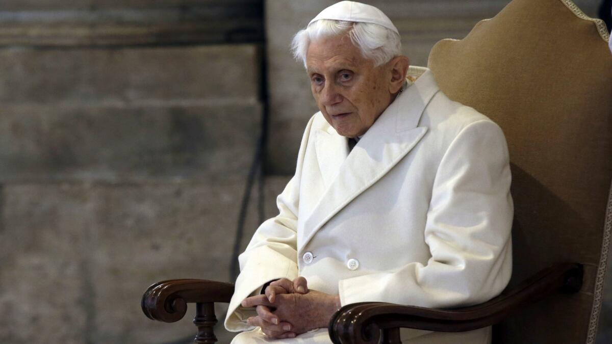 A Dec. 8, 2015, photo of Pope Emeritus Benedict XVI in St. Peter's Basilica at the Vatican.