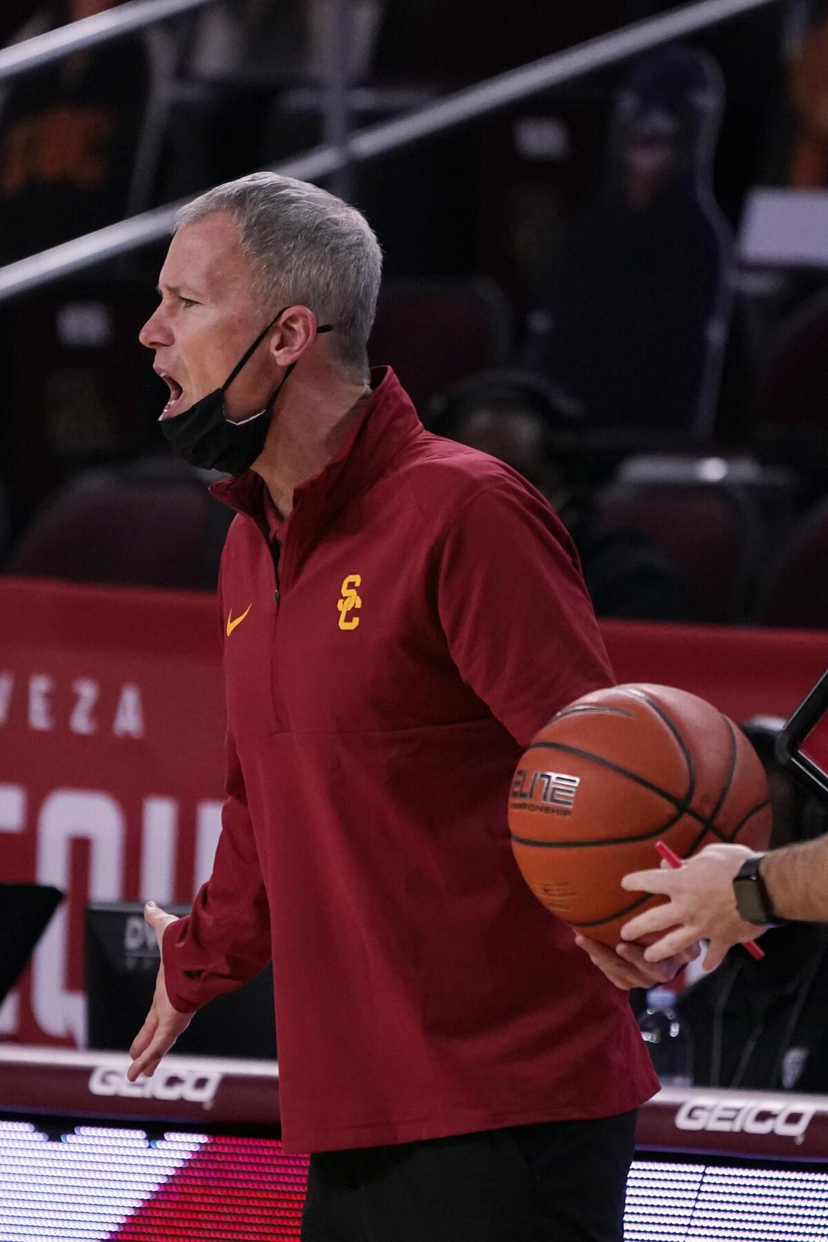 USC coach Andy Enfield shouts from the sideline during Saturday's loss to Arizona.