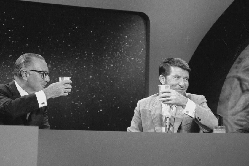 July 20, 1969 CBS NEWS Walter Cronkite, left and Walter "Wally" Schirra at the CBS News Space Center hold up a toast to the landing of the Apollo 11 Mission. #36064_k_14 Copyright CBS Broadcasting, Inc., All Rights Reserved, Credit: CBS Photo Archive