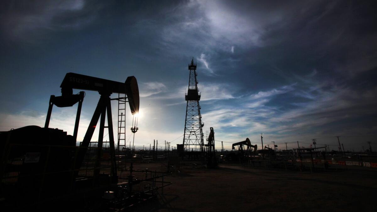 Oil pumps and drilling equipment in an oil field in Kern County, where the majority of California's oil and gas production is centered.