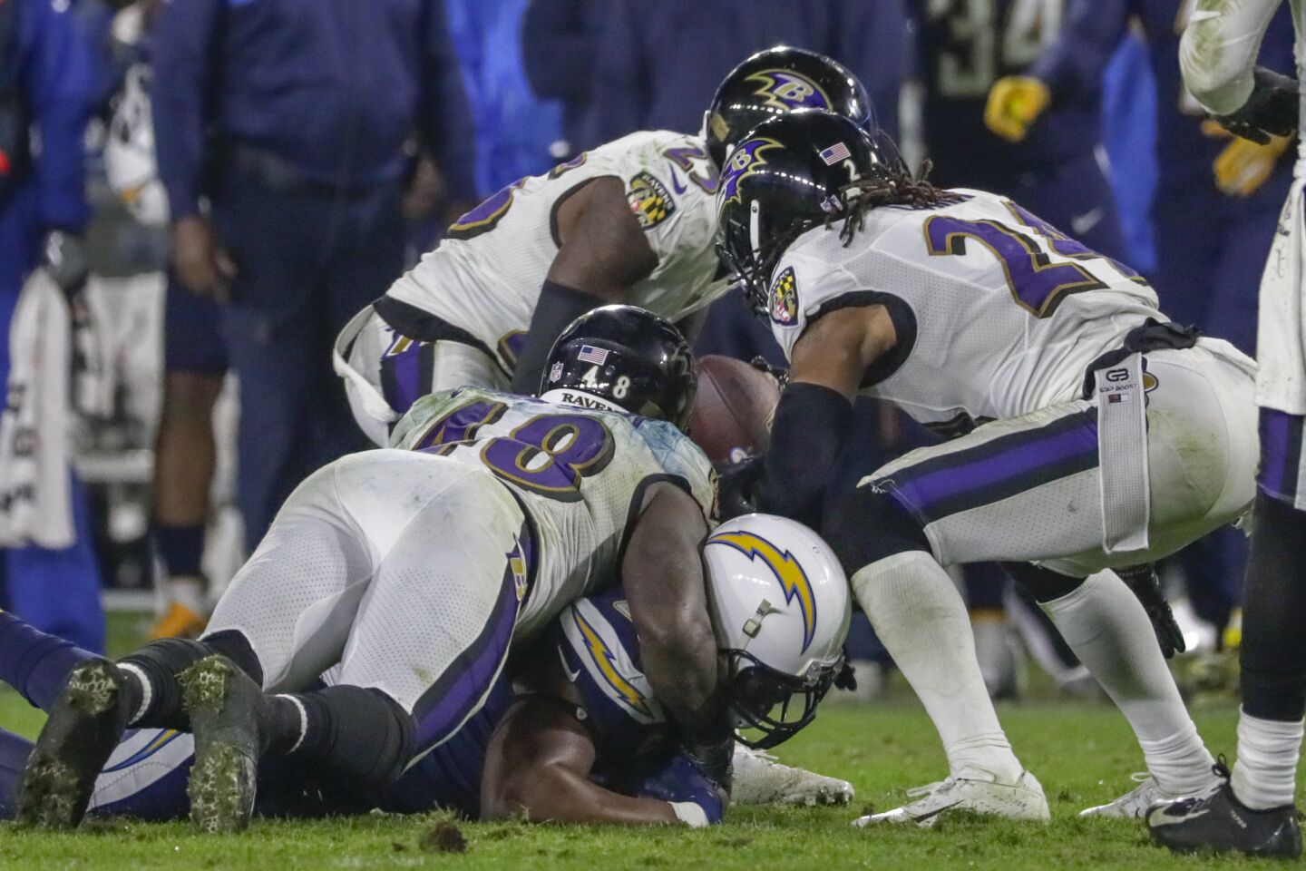 Ravens cornerback Tayvon Young takes the ball from Chargers tight end Antonio Gates and returns it for a touchdown late in the fourth quarter at StubHub Center.