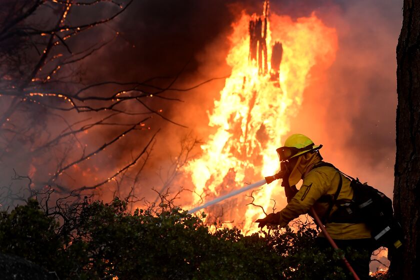 Lake Tahoe, CA. September 2, 2021: Firefighters battle battle the Caldor fire along highway 89 west of Lake Tahoe Thursday. (Wally Skalij/Los Angeles Times)
