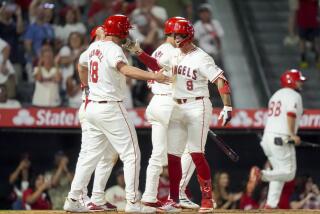 The Angels' Zach Neto celebrates with Nolan Schanuel after hitting a three-run home run during the seventh inning 