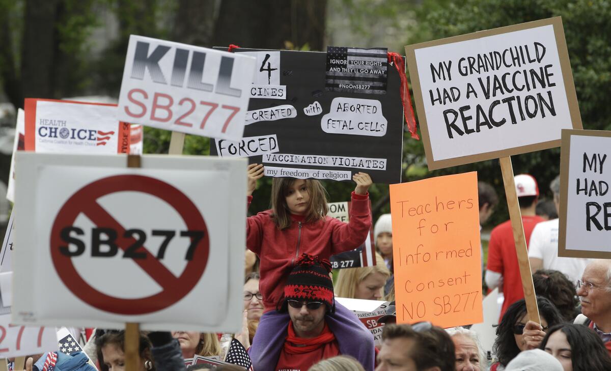 Outside the Capitol in Sacramento last week, protesters rally against a measure that would toughen vaccination requirements for children in California public schools.