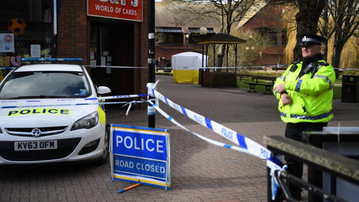 A police officer stands guard in Salisbury, England, on March 6, 2018, where former Russian spy Sergei Skripal and a woman reported to be his daughter were found unconscious on a bench.