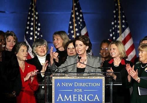 Incoming House Speaker Nancy Pelosi of Calif., center, accompanied by women members of Congress, makes remarks during a tribute to her and the late Texas Gov. Ann Richards.