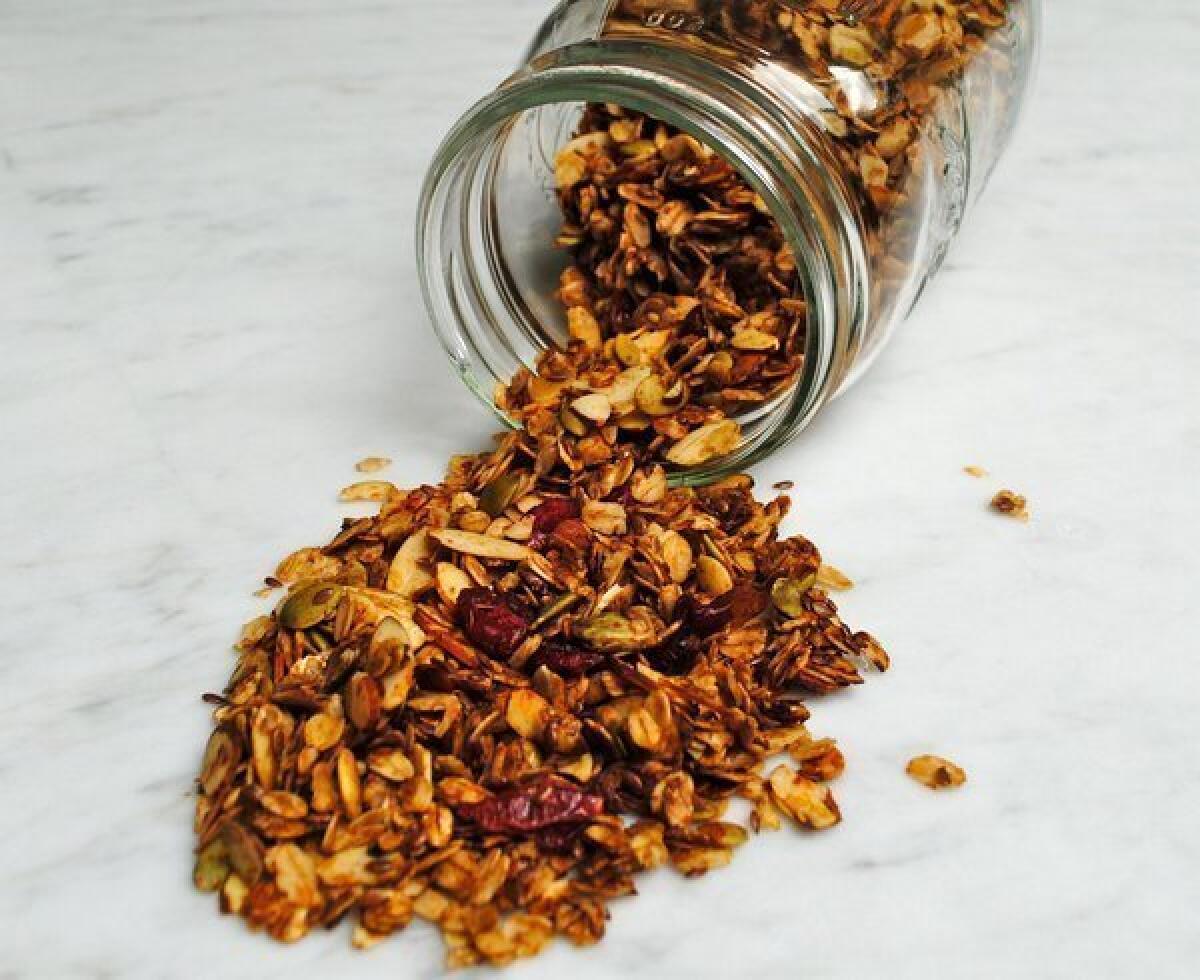 Homemade granola with chopped nuts and dried fruit.