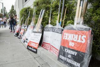 CULVER CITY, CA - MAY 09: Signs await distribution at the picket line at Sony Studios in Culver City on Tuesday, May 9, 2023 in Culver City, CA during the Writers Guild of America strike. (Myung J. Chun / Los Angeles Times)