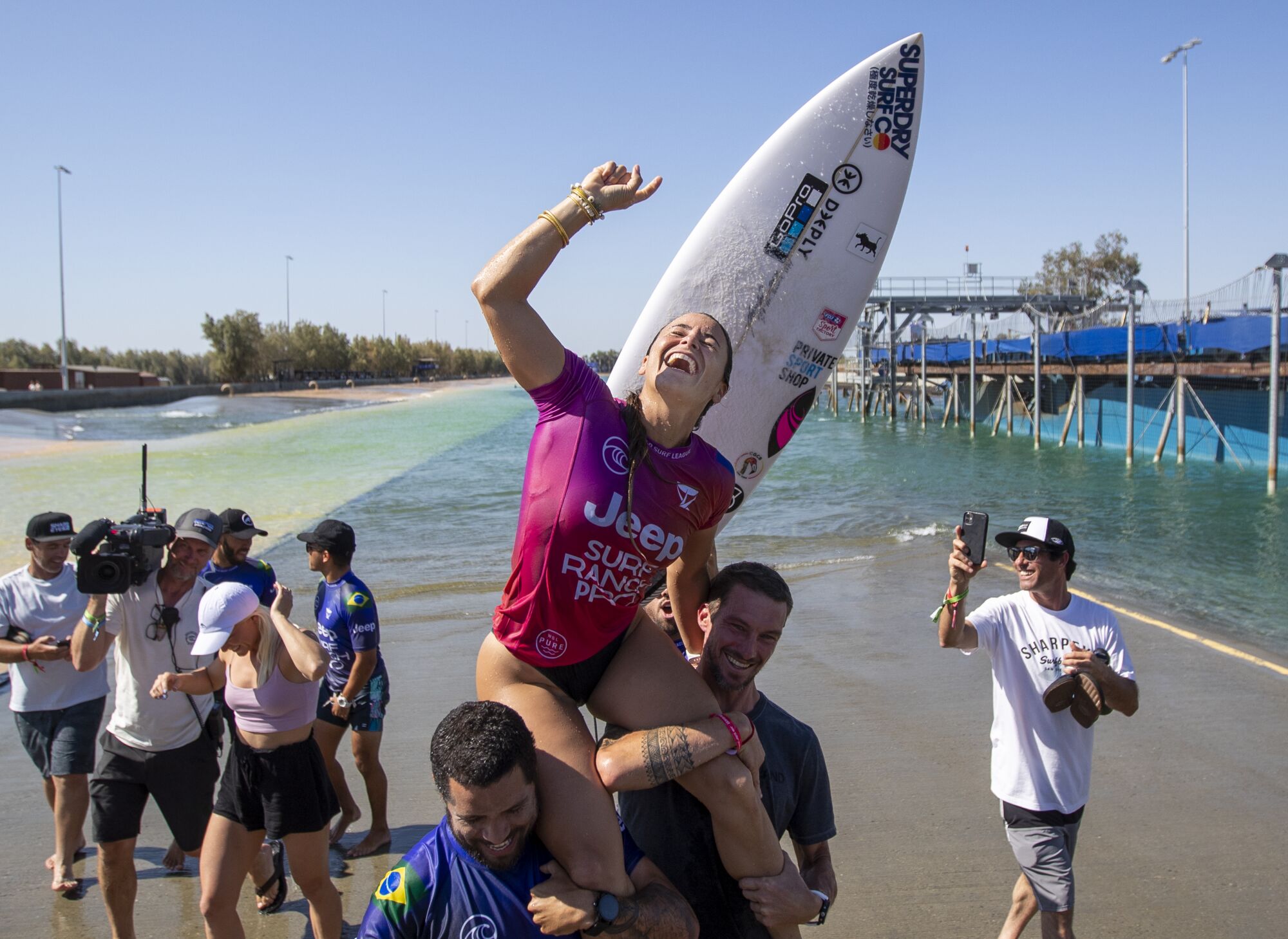Johanne Defay is carried on friends' shoulders after winning the Jeep Surf Ranch Pro women’s event.