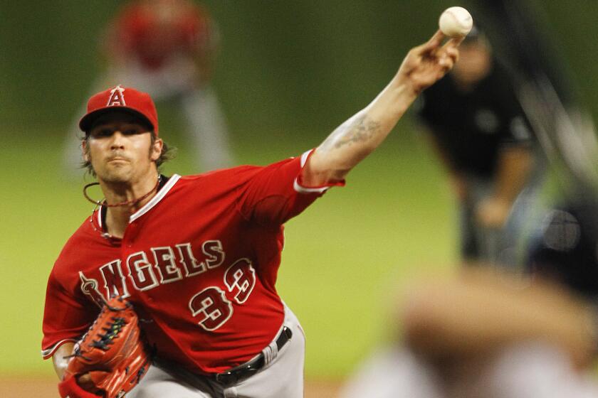 Angels starter C.J. Wilson delivers a pitch in the team's 8-3 loss to the Houston Astros on Tuesday.