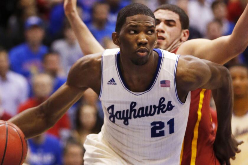Kansas center Joel Embiid drives to the basket during a game against Iowa State in January 2014.