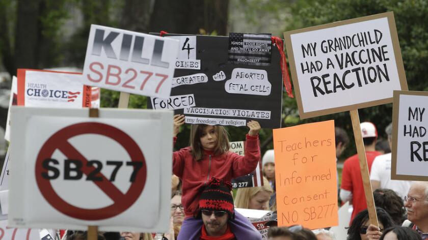 Outside the Capitol in Sacramento this spring, protesters rally against a measure that would toughen vaccination requirements for children in California public schools.