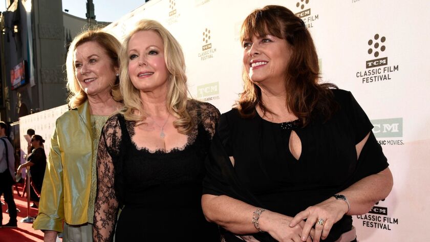Heather Menzies-Urich, from left, Kym Karath and Debbie Turner, cast members in "The Sound of Music," pose together before a screening of the film in Los Angeles on March 26, 2015. Menzies-Urich, who played one of the singing von Trapp children in the 1965 hit film, has died.