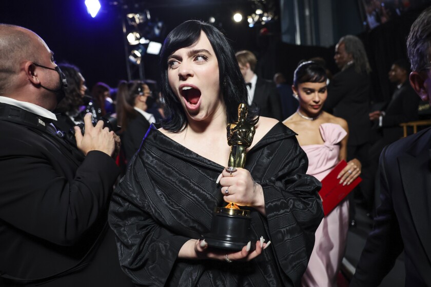 Billie Eilish, mouth agape, after winning an oscar