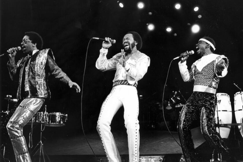 Maurice White, center, leads Earth Wind & Fire at the Forum in Inglewood on Dec. 12, 1981.