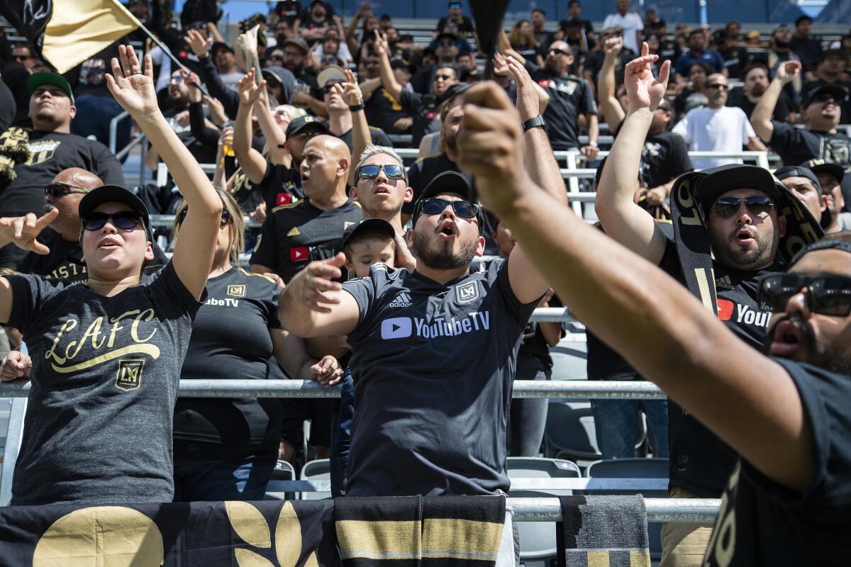 Fans go wild watching LAFC score against Montreal during a screening of the game at Banc of California Stadium on April 21.