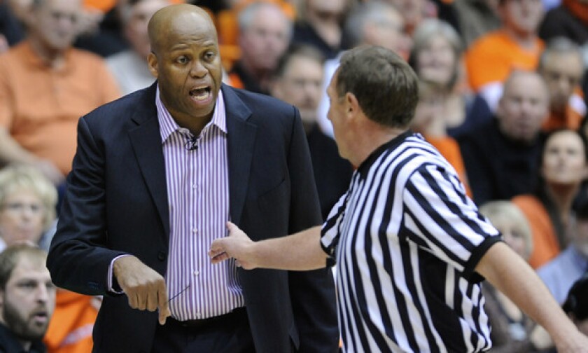 Oregon State Coach Craig Robinson argues a call during the Beavers' overtime win over USC on Thursday.