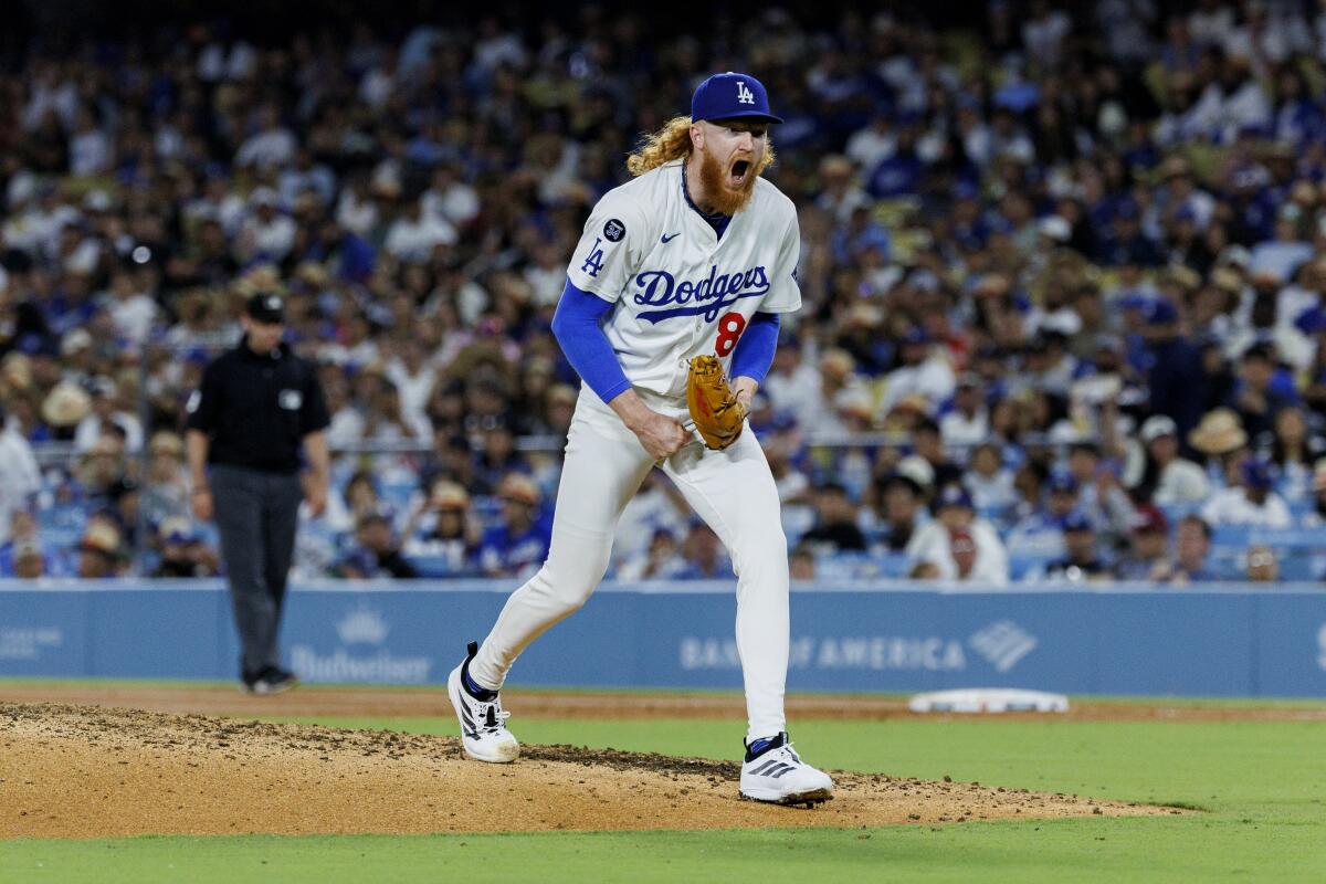Dustin May opens his mouth wide after striking out Chase Meidroth to end the sixth inning.
