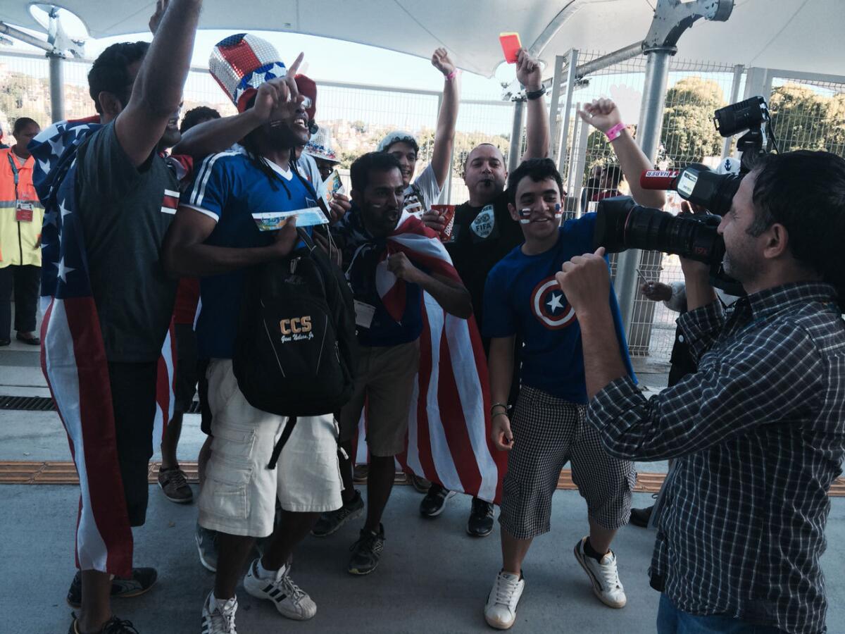 A group of U.S. fans gathers outside the stadium while awaiting the start of the game against Belgium.