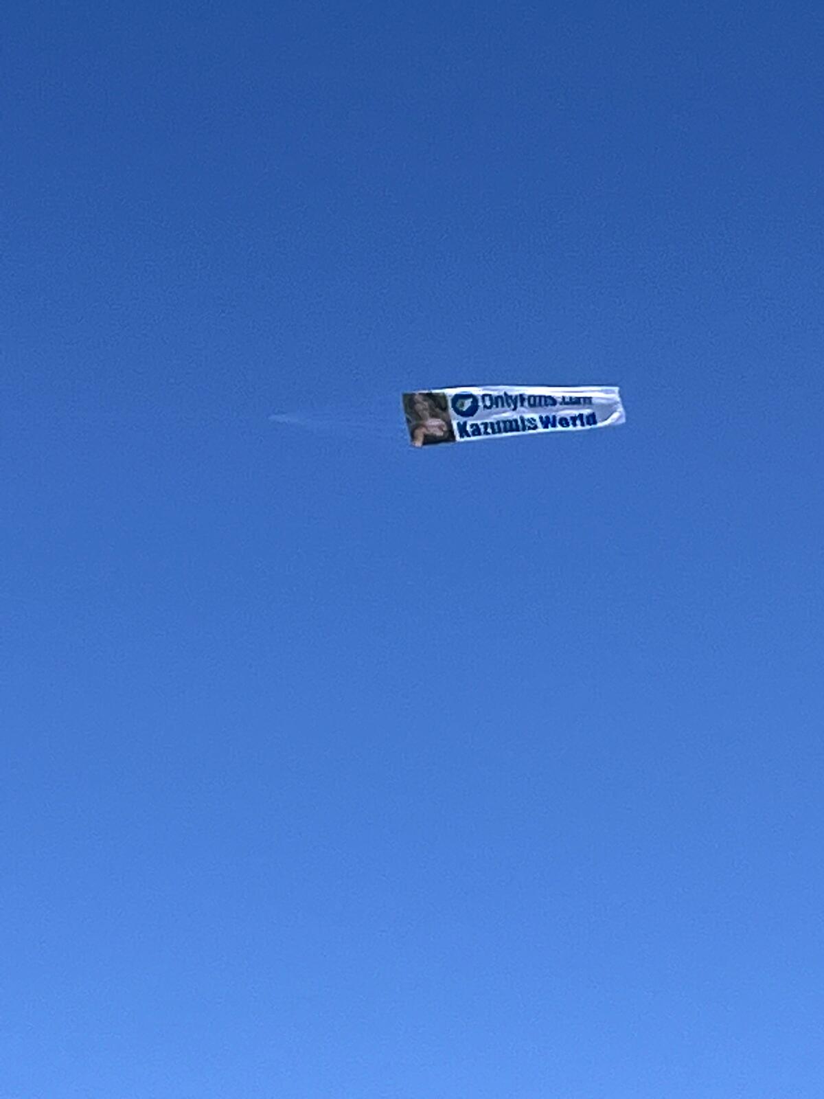 An airplane flying a banner