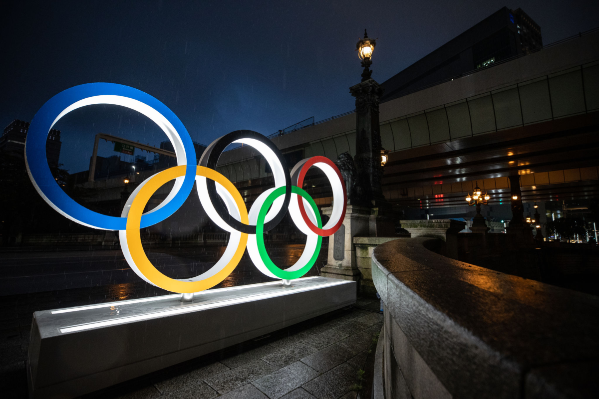 The Olympic Rings are illuminated at night