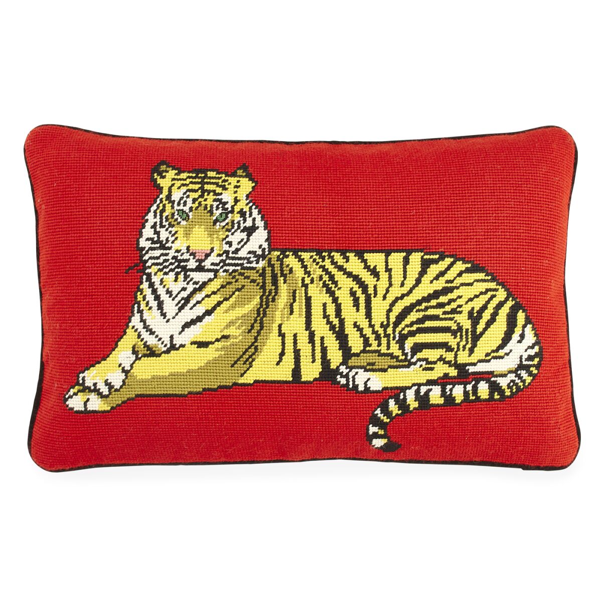 A red needlepoint pillow with a tiger design