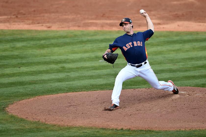 Neal Cotts pitches for the Houston Astros during a spring training game against the Atlanta Braves on March 9.