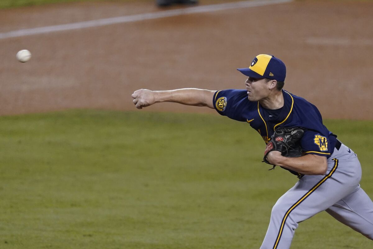Milwaukee Brewers relief pitcher Justin Topa throws during Game 1.