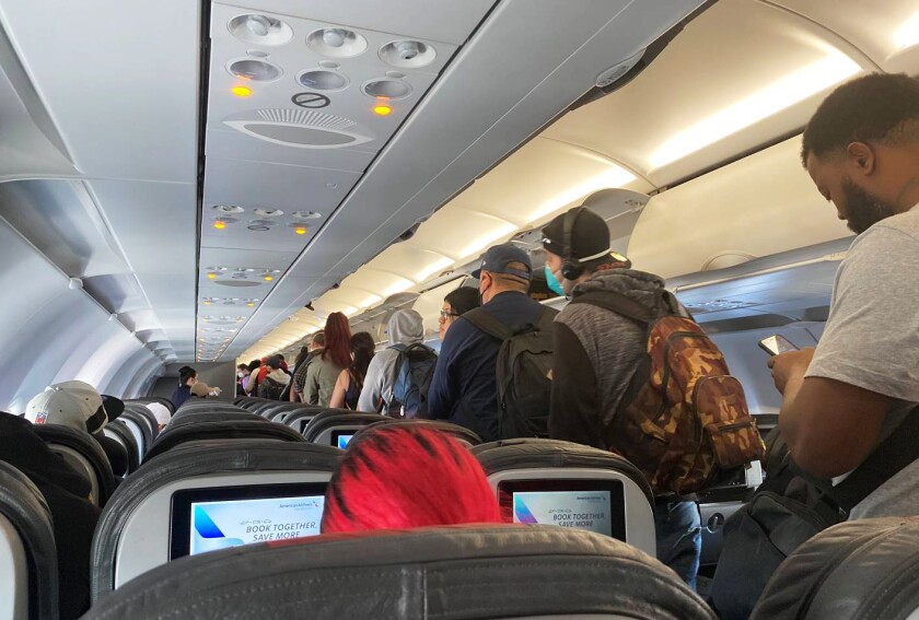 Virus Outbreak-Crowded Planes-Q&A