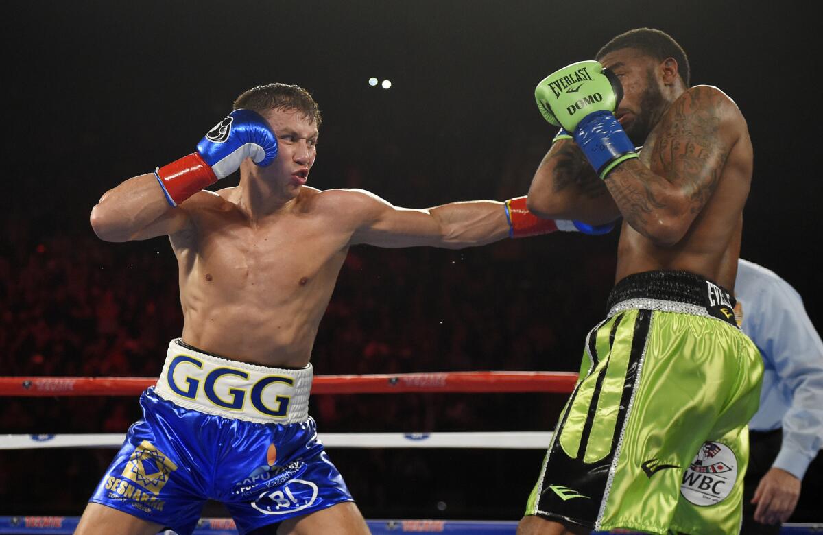 Gennady Golovkin, left, connects a punch against Dominic Wade during a middleweight title fight on Apr. 23.