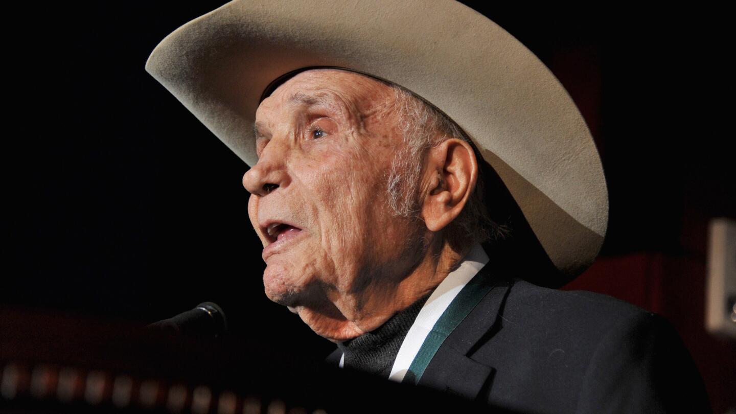 Former world middleweight champion boxer Jake LaMotta speaks during the 27th annual Great Sports Legends Dinner in New York City in 2012.