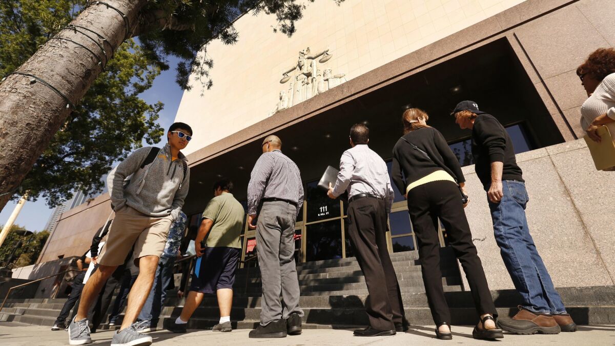 People in line to enter Stanley Mosk Courthouse in downtown L.A. 