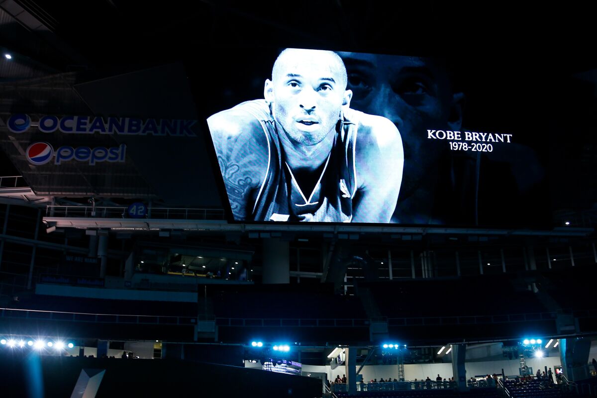 A moment of silence in memory of NBA great Kobe Bryant takes place during Super Bowl "Opening Night" at Marlins Park in Miami.