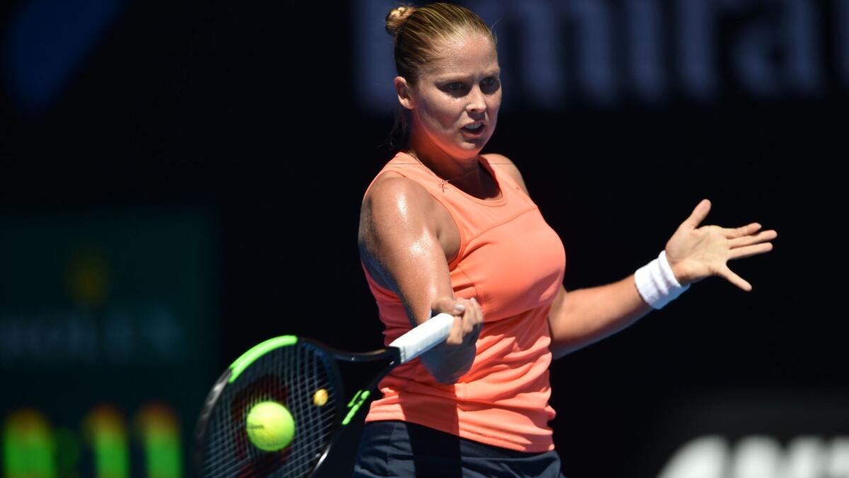 Shelby Rogers returns a shot against Simona Halep during their women's singles match on Monday at the Australian Open.