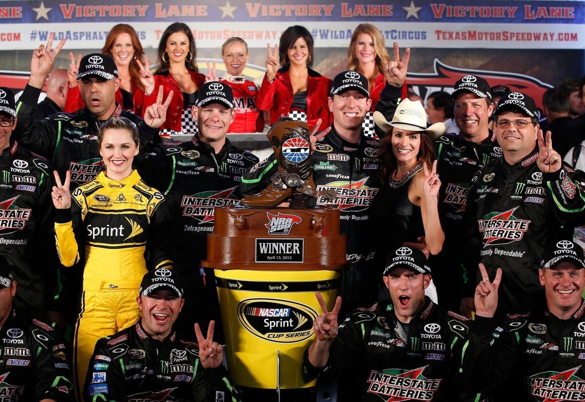 Kyle Busch celebrates in Victory Lane after winning the NASCAR Sprint Cup Series NRA 500 at Texas Motor Speedway.