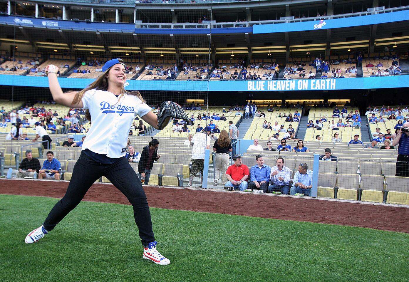 Photo Gallery: Olympian Kate Hansen throws out first pitch of Dodger game