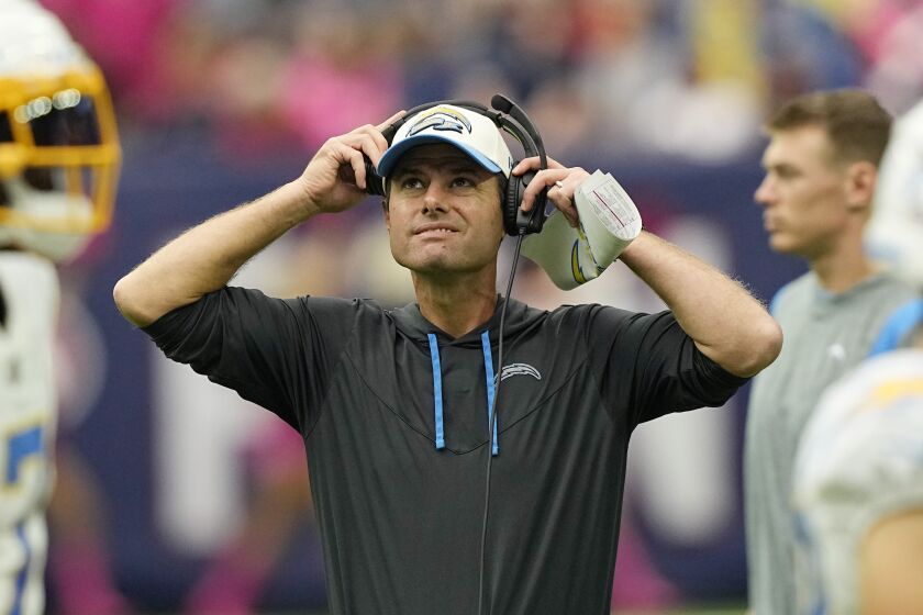 Los Angeles Chargers head coach Brandon Staley watches from the sidelines during the first half of an NFL football game against the Houston Texans, Sunday, Oct. 2, 2022, in Houston. (AP Photo/David J. Phillip)