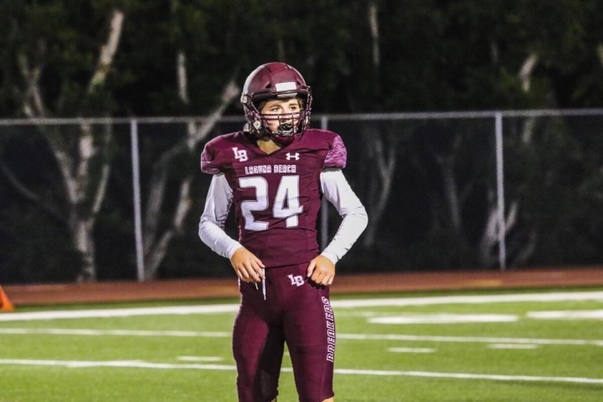 Bella Rasmussen of Laguna Beach looks toward the sideline during a high school football game.